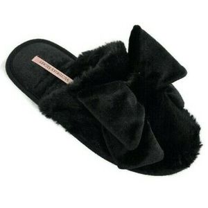 Black fuzzy Victoria Secret slippers with a bow